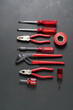 © Alvaro - Tools organized neatly on a dark surface in a workshop setting for repair tasks