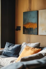 Poster - A comfortable living room with a sofa and a beautiful painting on the wall, perfect for relaxing at home