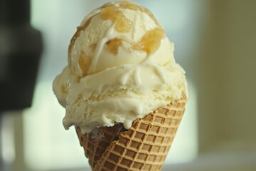 Poster - A delicious waffle cone filled with a scoop of creamy ice cream