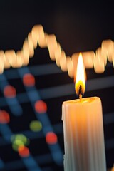Aufkleber - A single lit candle sits on top of a table in a warm glow