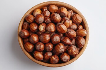 Aufkleber - A wooden bowl filled with nuts sits on a white table, perfect for snacks or decorations