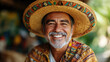 © ValentynHrom - Portrait of smiling Mexican man in traditional Mexican clothes and sombrero hat. Man in Mexican national style.