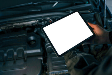 Aufkleber - A tablet with a blank screen held by a mechanic above a car engine, symbolizing modern diagnostic tools for vehicle maintenance and repair. The engine is visible in the background