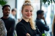 © Snap Vivid - Blonde female executive posing with smile and arms crossed during brainstorm with managers. Indoor portrait of european student spending time in hall with asian and african friends., Generative AI