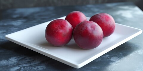 Poster - Plum frost displayed on a white plate highlights the vibrant colors. The frost on the plum adds a cold, bright touch, showcasing the juicy essence of this delicious plum frost.