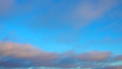 Poster - Observe dynamic flow of clouds against a vibrant blue sky, real time capture. Experience gradual shifts in skyscape during different moments in the day. Weather forecast. Climate change. Slow motion.