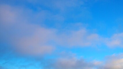 Poster - Observe dynamic flow of clouds against a vibrant blue sky, real time capture. Experience gradual shifts in skyscape during different moments in the day. Weather forecast. Climate change. Slow motion.