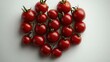 © Vesovic  - A creative arrangement of fresh tomatoes shaped like a heart, celebrating love and health in culinary art.