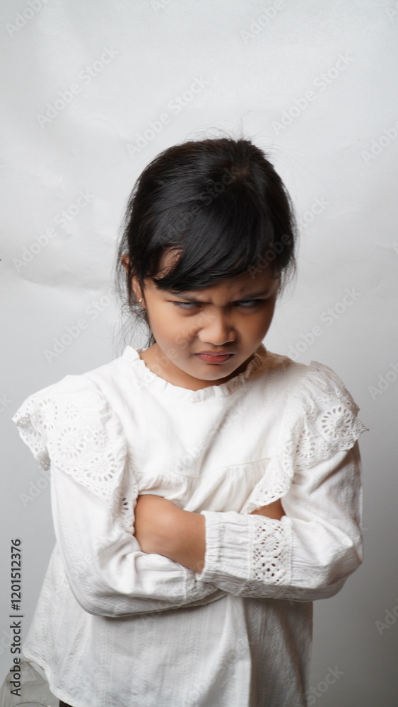 Portrait of an Asian girl with a white background wearing