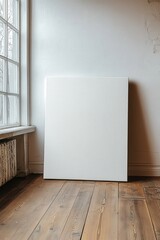 Poster - blank canvas art mockup in natural light by the window with wooden floor creating a minimalistic hom