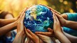 © Umnat - A collective commitment to saving the planet is showcased with multiple hands holding the globe.
