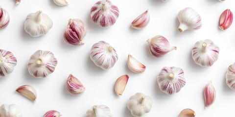 Poster - Top view of fresh organic garlic arranged on a clean white background, highlighting the natural beauty and texture of organic garlic. Discover the vibrant details of fresh organic garlic.