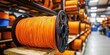 © Nats - The striking contrast of orange cables resting on rustic wood.