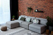 © New Africa - Modern living room interior. Comfortable sofa near brick wall