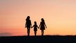 © Intelligent Horizons - Silhouette of a loving family with mother and two children standing together against a serene sunset landscape