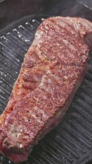 Canvas Print - delicious juicy wagyu beef steak meat cooking on a grill pan. Process of making perfect steak at home