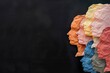 © Olha Yavorska - paper silhouettes of human heads on the side, different skin color, multicultural