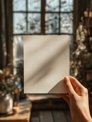 Poster - Textured Paper Sheet Held Against a Snowy Winter Window
