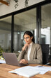 © Stock 4 You - Focused professional financial it specialist latin hispanic business lady working on laptop pc sitting in office. Middle eastern indian woman using computer technology app for work online. Vertical