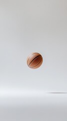 Poster - Single basketball hovers in the center of a minimalist white studio setting, creating a striking visual with a focus on the sporting goods and the concept of levitation