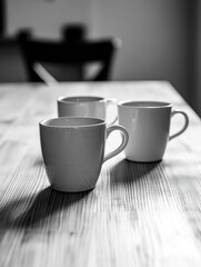 Wall Mural - Wooden Table with Coffee Cups