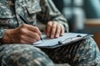 © Watcher - Soldier Filling Out Forms Close-Up of Military Personnel Completing Paperwork