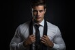 © Vlad - Confident Attractive Businessman Fixing Tie on Dark Background