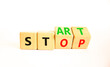 © Dzmitry - Start or stop symbol. Concept words Start or Stop on beautiful wooden block. Beautiful white table white background. Business start or stop concept. Copy space.