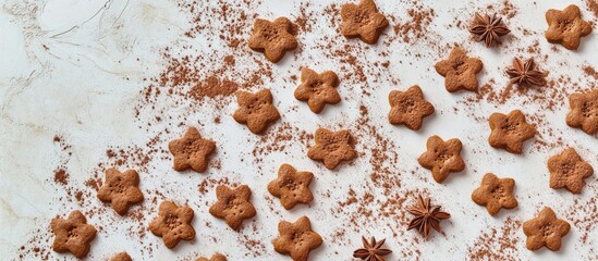 Poster - Gingerbread cookies in star shapes arranged on a textured surface with cocoa powder and star anise scattered in the background Copy Space