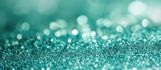 Leinwandbilder - Turquoise glitter background with soft bokeh effect and copy space for text placement.