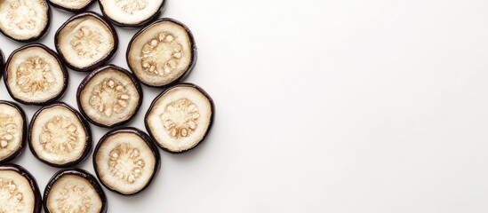 Poster - Sliced eggplant on a white background with copy space for text placement