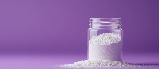Poster - Clear glass jar filled with white powder on a purple background with Copy Space for text placement