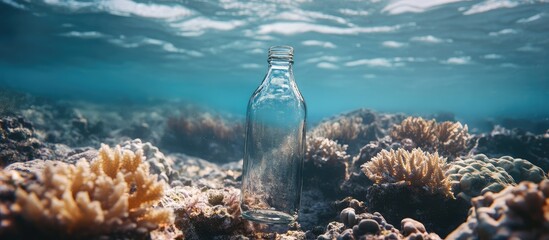 Aufkleber - Underwater scene featuring a glass bottle among coral formations with sunlight filtering through water Copy Space