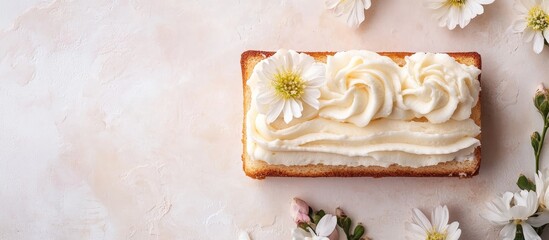 Poster - Cake with cream frosting and edible flowers on a light background with copy space