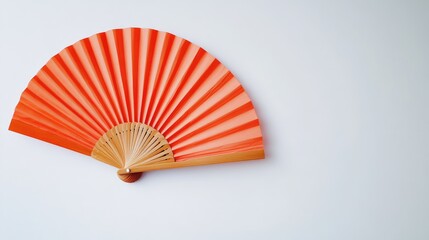 Poster - Red decorative hand fan mounted on a white wall with Copy Space for text placement.
