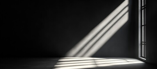 Poster - Empty room with shadows and light rays coming through a window onto a dark floor Copy Space