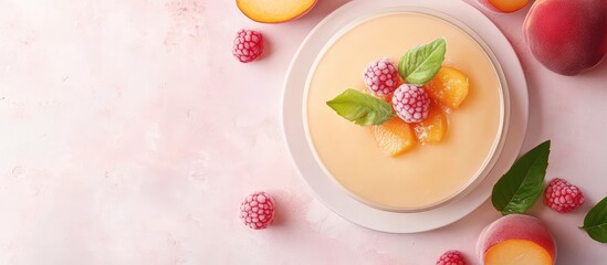 Aufkleber - Peach mousse cake adorned with raspberries and mint leaves on a pastel background with Copy Space for text placement