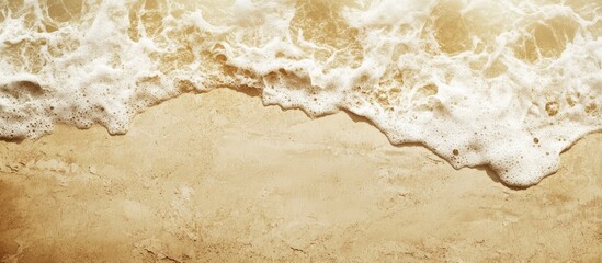 Poster - Golden sandy beach with ocean waves and foam Copy Space for text placement