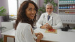 © Krakenimages.com - Woman smiling with male doctor in hospital office suggesting a positive medical consultation in a clinical setting with healthcare focus.