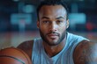 © toko - A focused basketball player holding a ball, showcasing determination and athleticism.