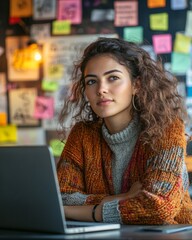 Poster - Contemporary Creative Workspace Young Latina Woman with Laptop at Collaborative Desk Amid Sticky Notes and Sketches - Boosting Innovation and Productivity in Modern Offices