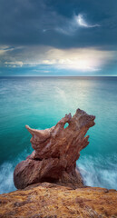 Wall Mural - rock in form of dragon head during the sunset.