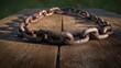 © PB Studio - weathered chain link broken into pieces, lying across an old wooden surface with a soft light highlighting the rust, symbolizing the end of oppression. struggle for freedom.