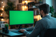 © SITI - Man Working on Computer with Green Screen in a Cozy Home Office at Night