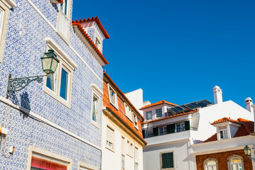 Wall Mural - Cascais, Portugal. Old architecture with traditional colorful glazed tile against the blue sky.