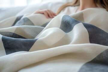 Aufkleber - Soft, cream-colored linen blanket with grey stripes, a person rests underneath.