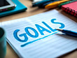 © SnapScape - Notepad with 'Goals', pen, and coffee