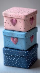 Wall Mural - Three small pastel-colored gift boxes with heart pattern.