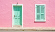 © ON - Studio - Colorful mint green door and shutters on pink wall, vibrant architecture