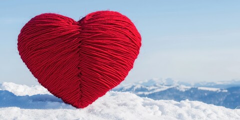 Wall Mural - Giant red yarn heart on snowy hillside landscape scene. Winter romance decoration